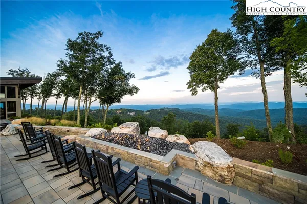 a view of a patio with furniture and yard