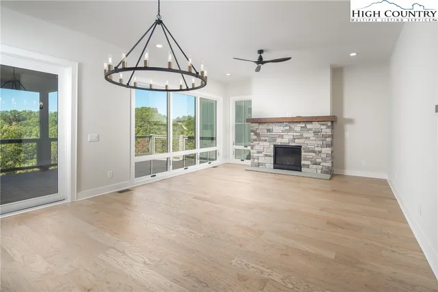 an empty room with windows and outdoor view