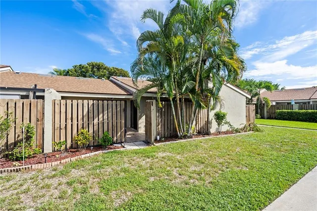 a view of a backyard with a garden and plants