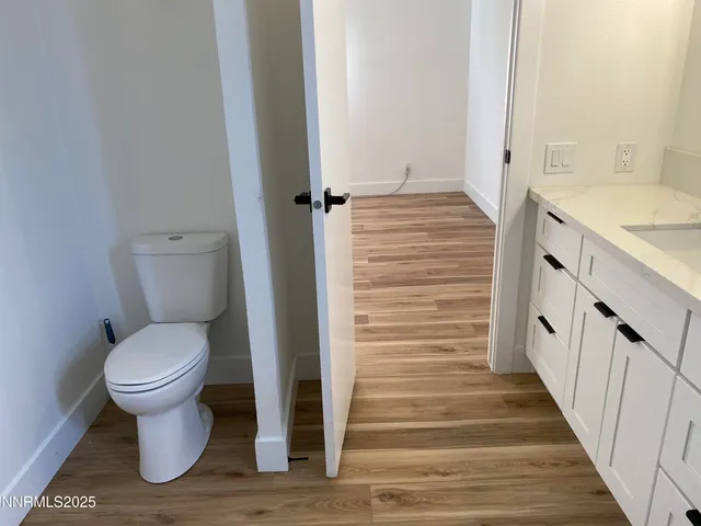 a bathroom with a toilet and a sink