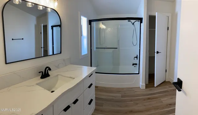 a bathroom with a sink and mirror