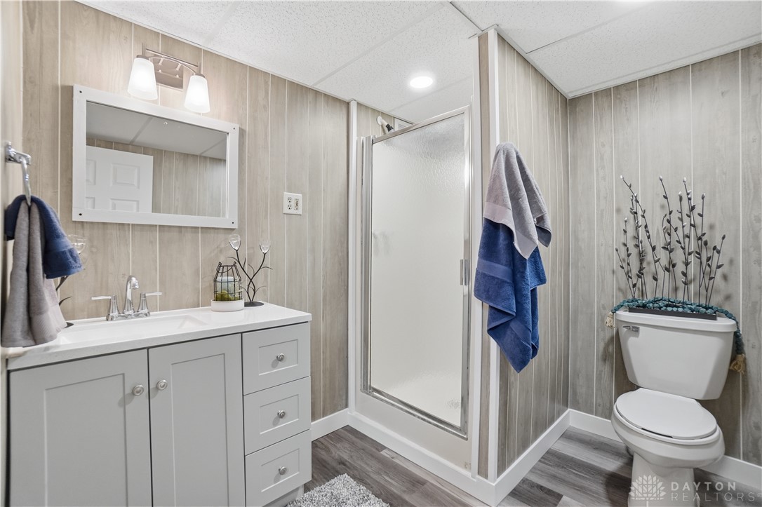 7553 Coffin Station Road Springfield, OH 45502 - Photo 75 of 95 This bathroom features a contemporary vanity, a glass-enclosed shower, and sleek fixtures.