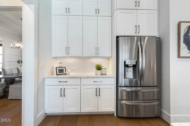 a open kitchen with stainless steel appliances granite countertop a sink stove and refrigerator