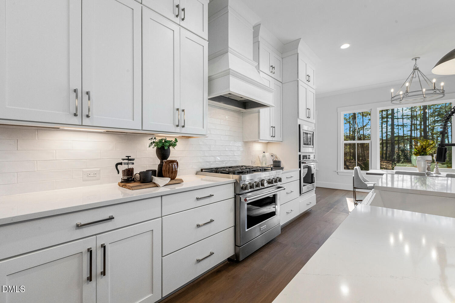 2321 Toll Mill Court Raleigh, NC 27606 - Photo 21 of 82 a kitchen with cabinets and stainless steel appliances