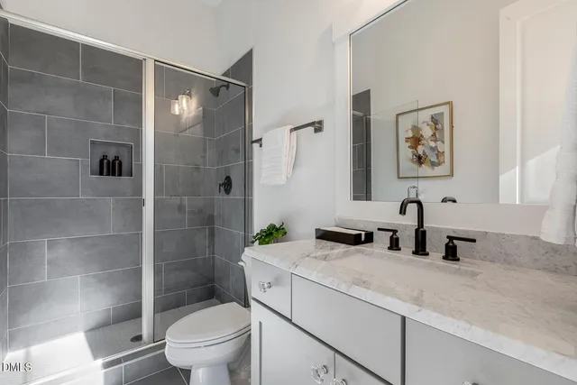 an empty room with a ceiling fan and a window