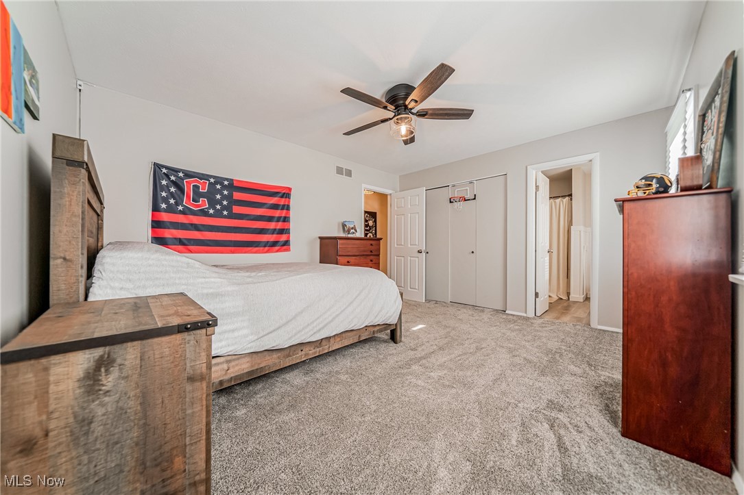 595 Moorfield Road Fairlawn, OH 44313 - Photo 25 of 50 Carpeted bedroom with a ceiling fan and a closet