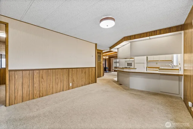 a view of a hallway with wooden shelves