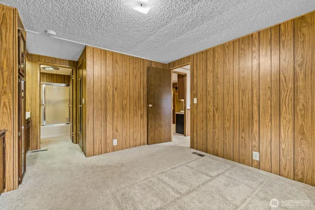 a white toilet sitting next to a shower