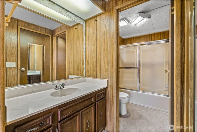 a view of a room with a wooden walls