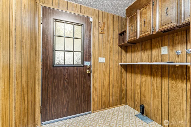 a view of a dinning table and chairs in the balcony