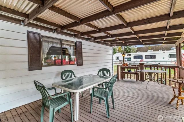 a view of a house with a backyard and porch