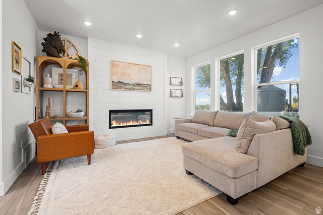 2706 West Maple Street, Unit 285 Mapleton, UT 84664 - Photo 7 of 36 Living area featuring wood-finish flooring, recessed lighting, and large windows