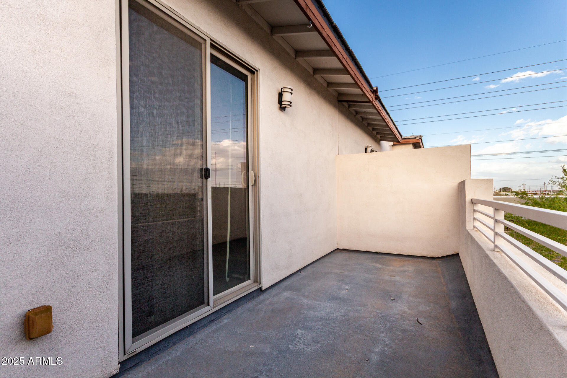 1056 North Miller Road Tempe, AZ 85288 - Photo 11 of 46 a view of a refrigerator in kitchen and an empty room