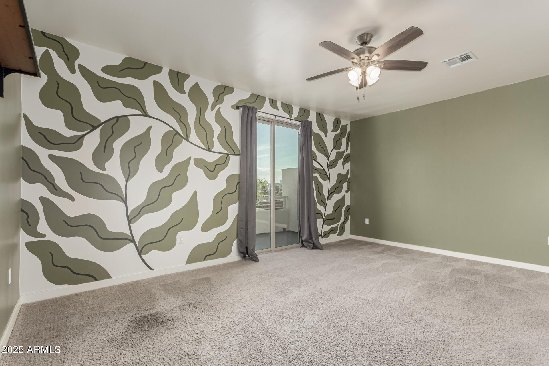 1056 North Miller Road Tempe, AZ 85288 - Photo 15 of 46 a view of an empty room with a ceiling fan