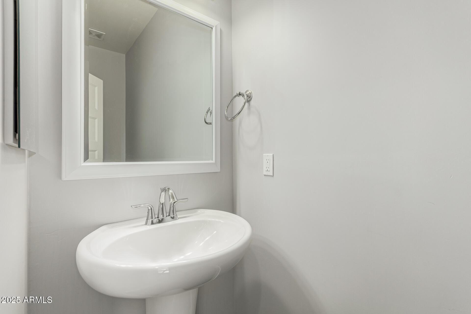 1056 North Miller Road Tempe, AZ 85288 - Photo 29 of 46 a bathroom with a sink and a mirror