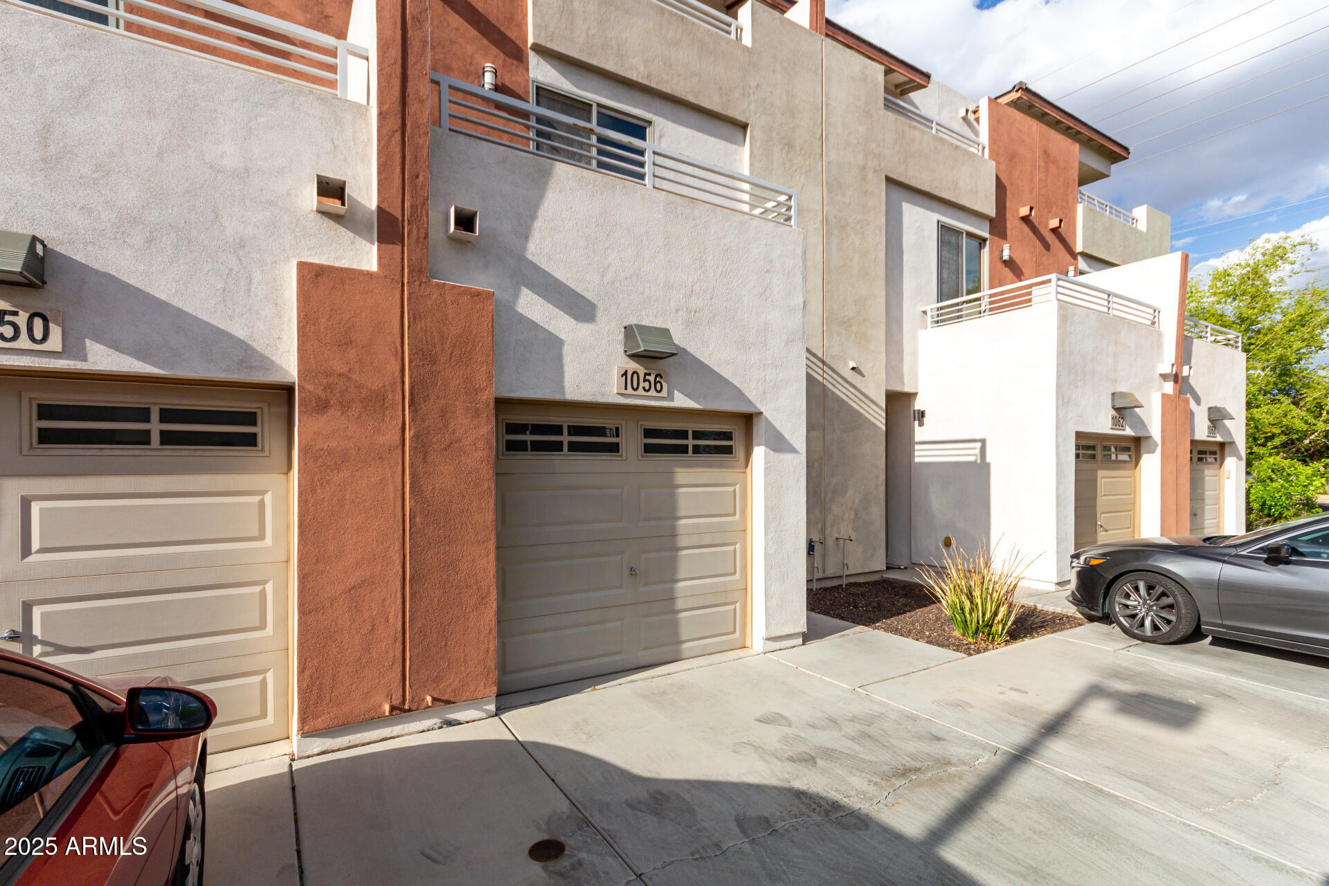1056 North Miller Road Tempe, AZ 85288 - Photo 33 of 46 a view of a house with a car parked in front of it