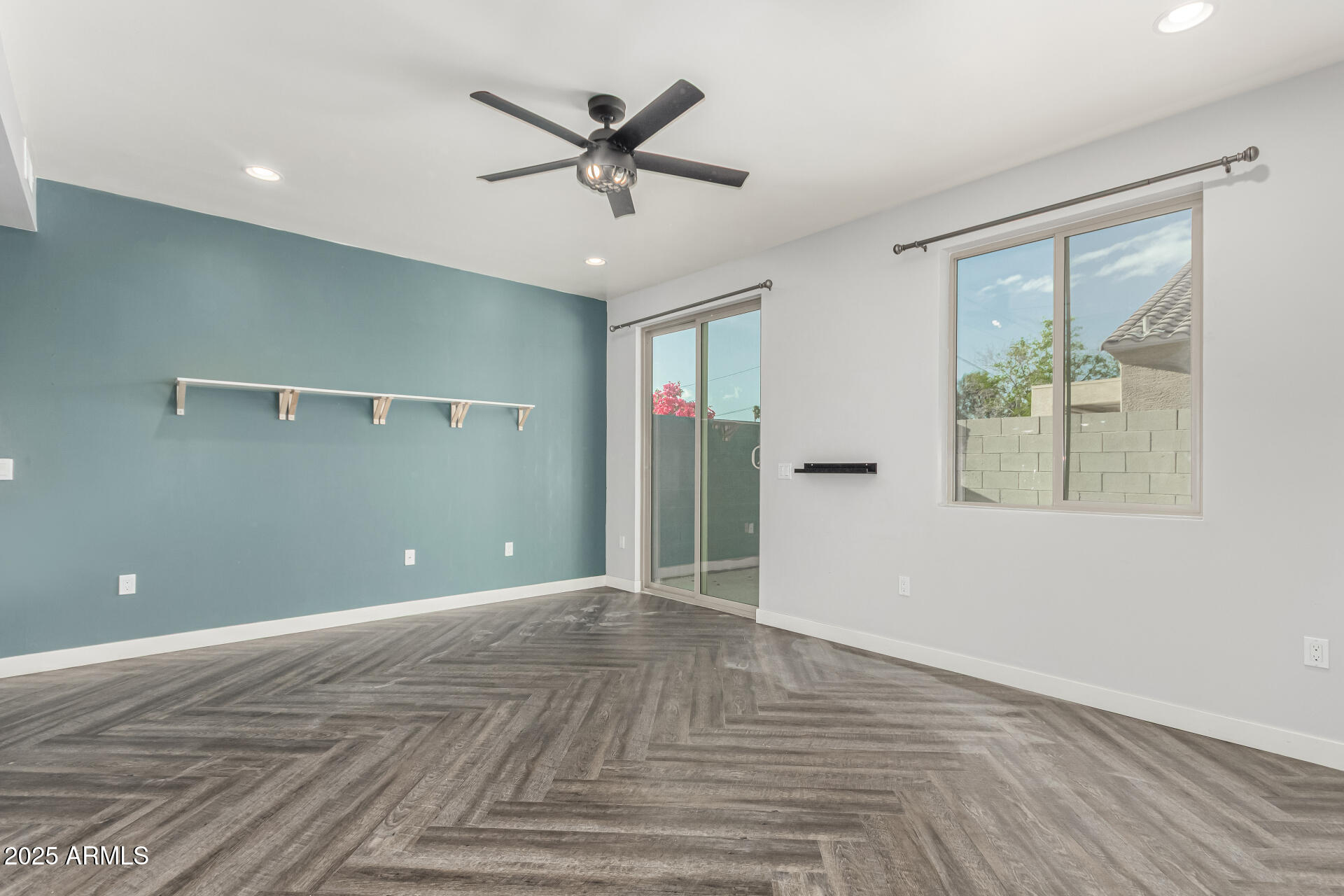 1056 North Miller Road Tempe, AZ 85288 - Photo 4 of 46 a view of a big room with wooden floor and windows