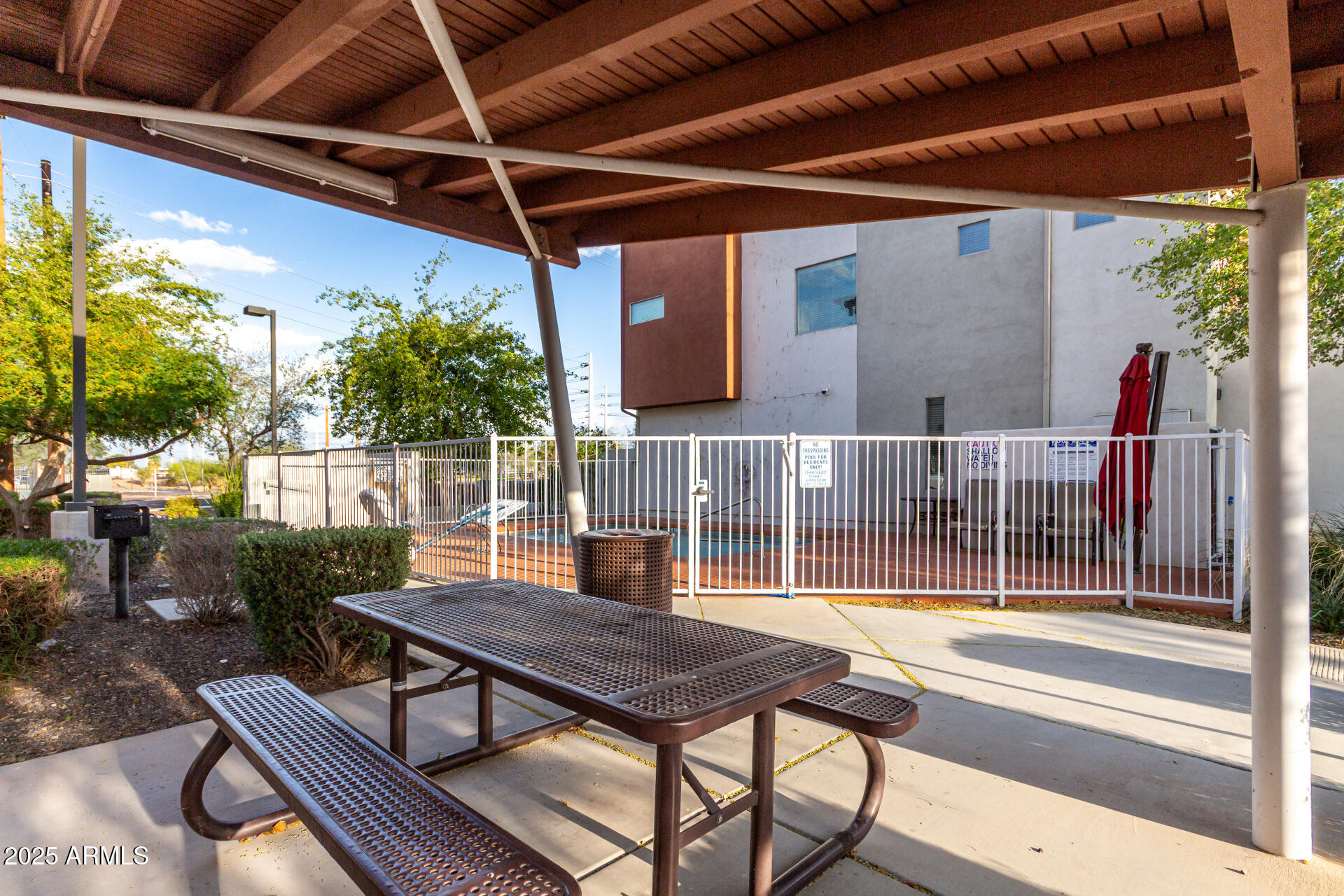 1056 North Miller Road Tempe, AZ 85288 - Photo 45 of 46 a view of a patio with table and chairs and potted plants