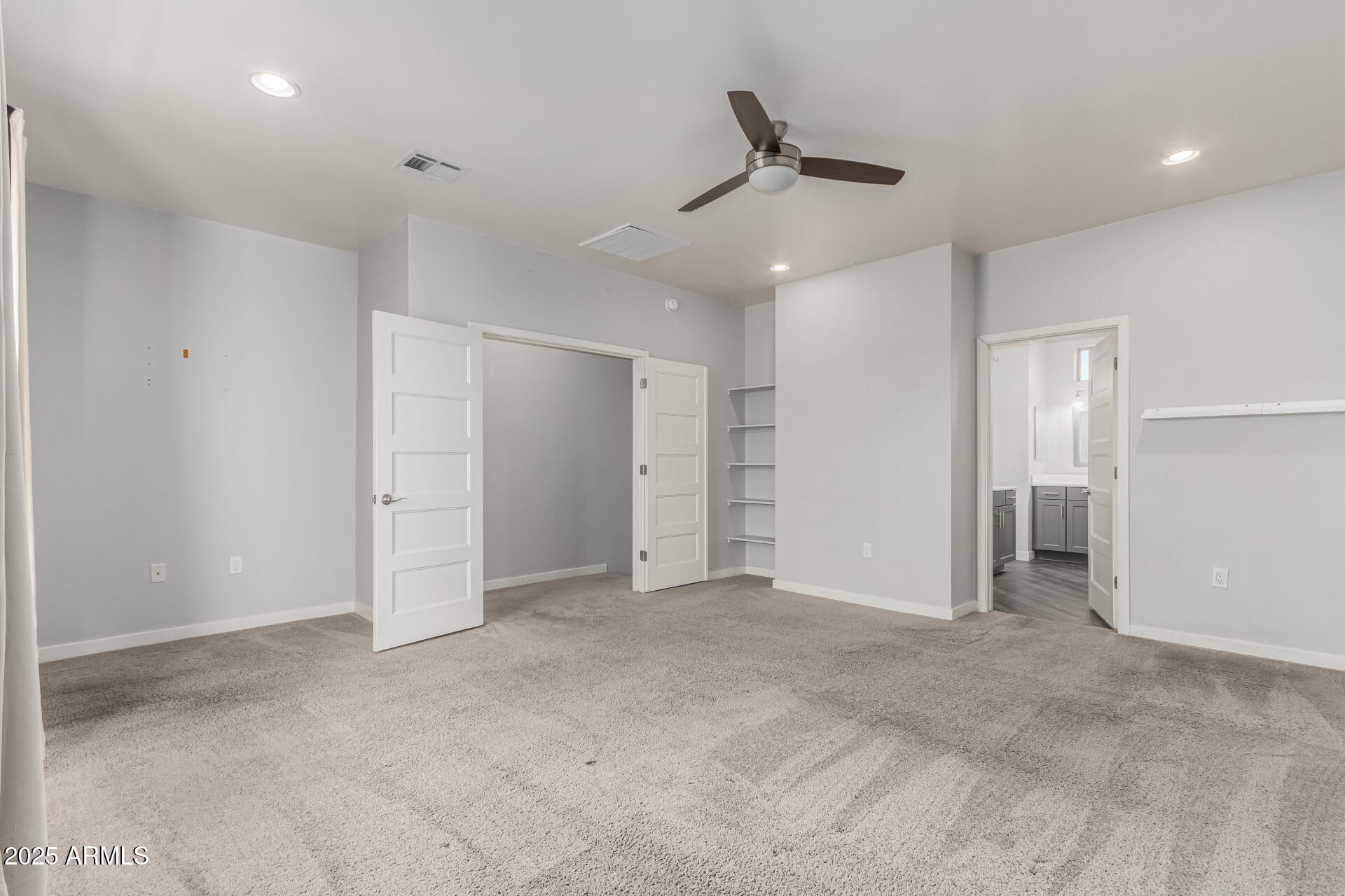 1056 North Miller Road Tempe, AZ 85288 - Photo 7 of 46 an empty room with a ceiling fan