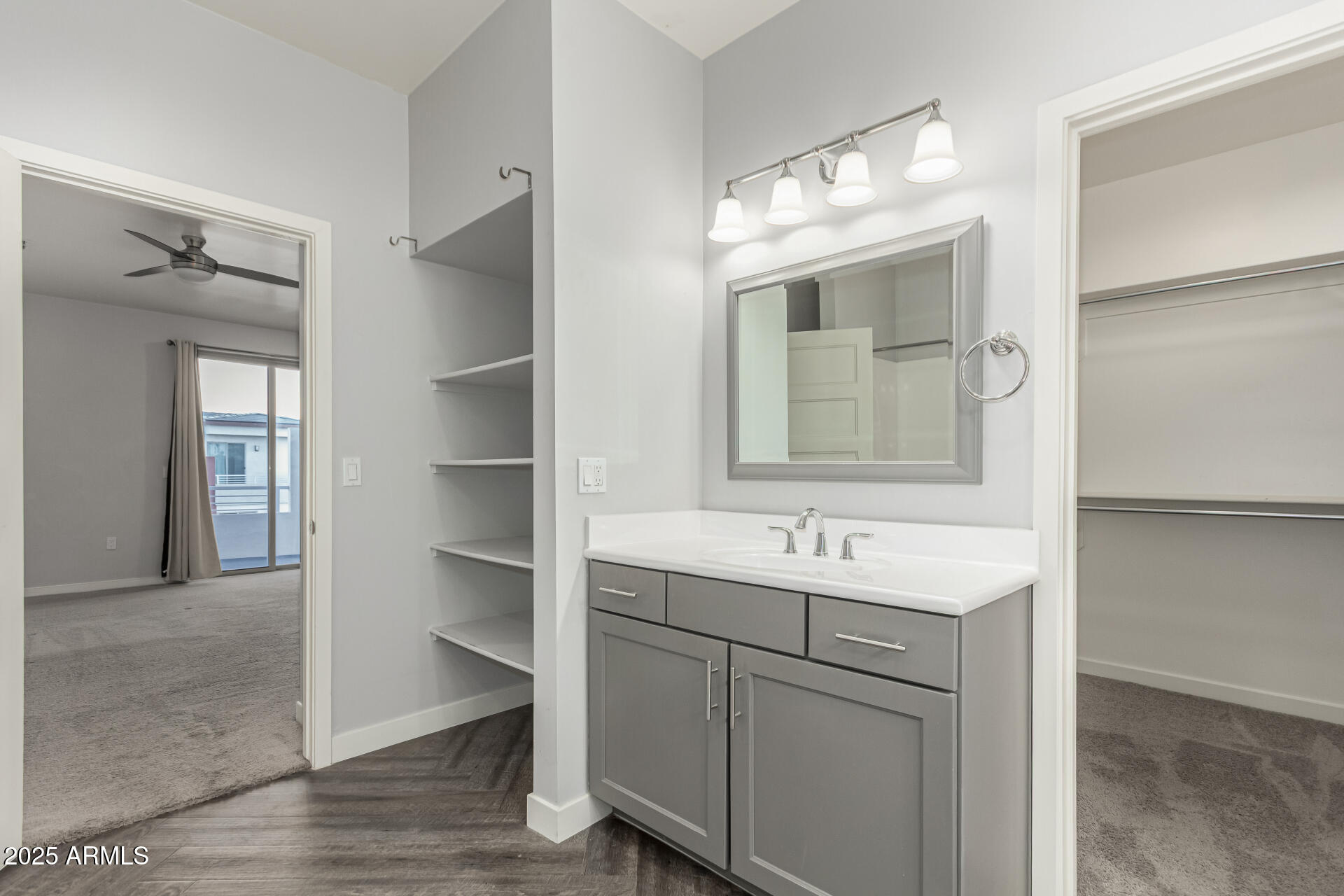 1056 North Miller Road Tempe, AZ 85288 - Photo 8 of 46 a bathroom with a sink and a mirror