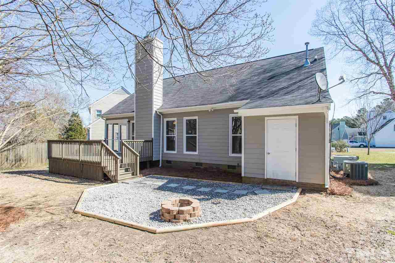 4556 Birmingham Way Raleigh, NC 27604 - Photo 21 of 24 a front view of a house with a yard and garage