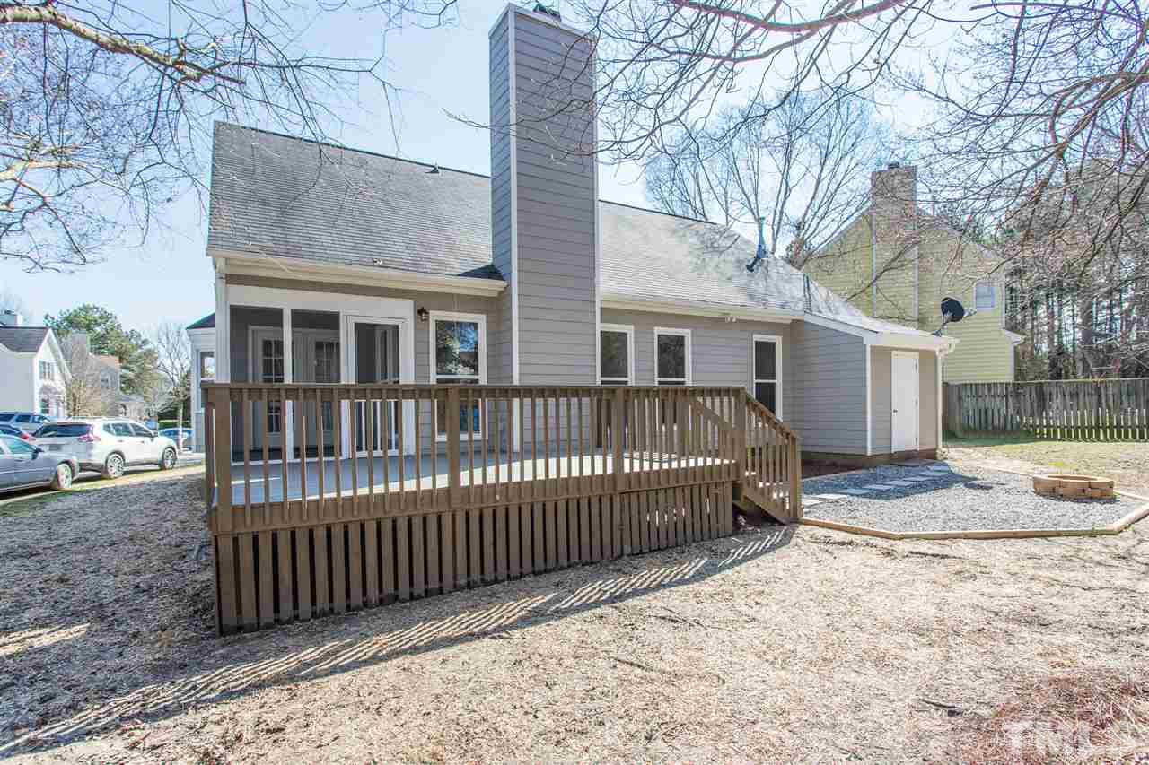 4556 Birmingham Way Raleigh, NC 27604 - Photo 22 of 24 a view of a house with a wooden deck