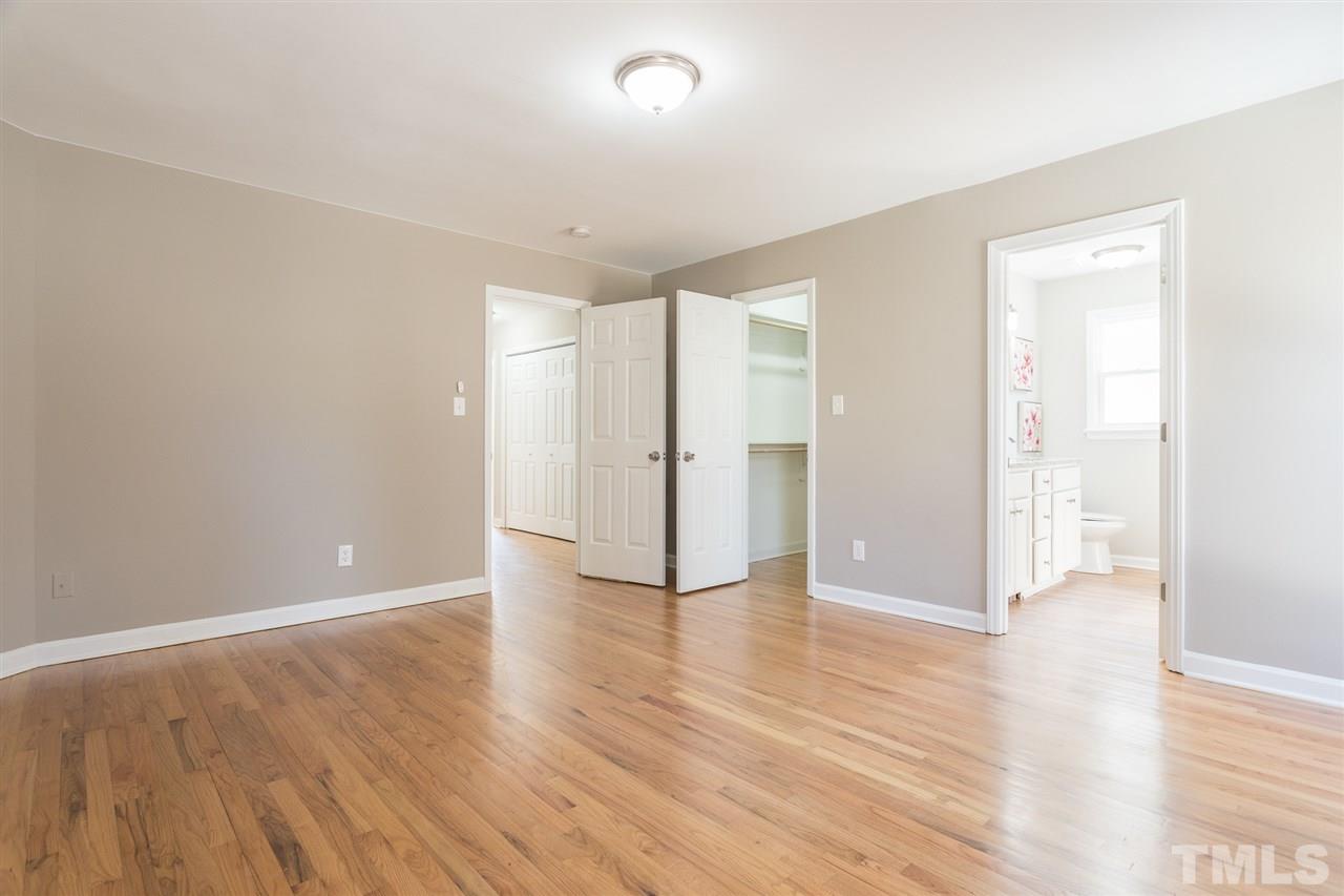 4556 Birmingham Way Raleigh, NC 27604 - Photo 5 of 24 a view of an empty room with wooden floor