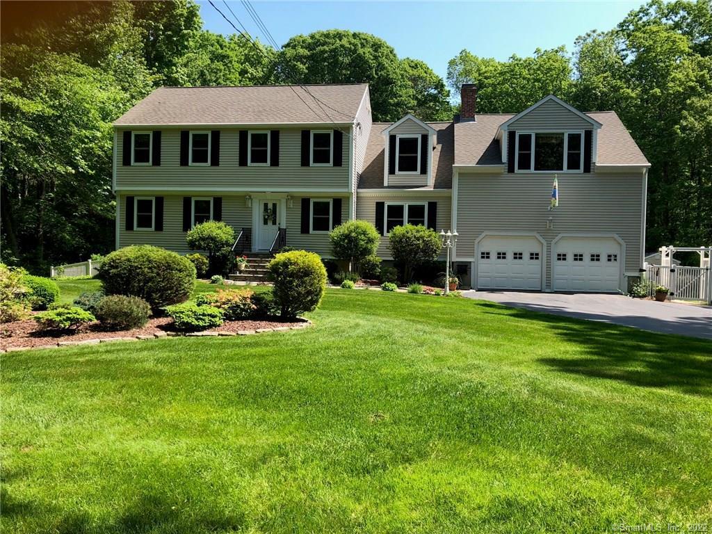 Exterior front with lush lawn.