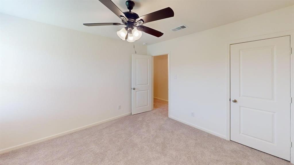 4529 Winecup Road Melissa, TX 75454 - Photo 14 of 29 Neutral-toned carpeting and light wall finishes provide a versatile backdrop