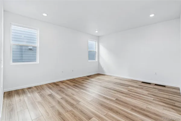 a view of kitchen and wooden floor