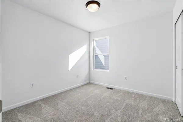 a view of a wooden floor with windows