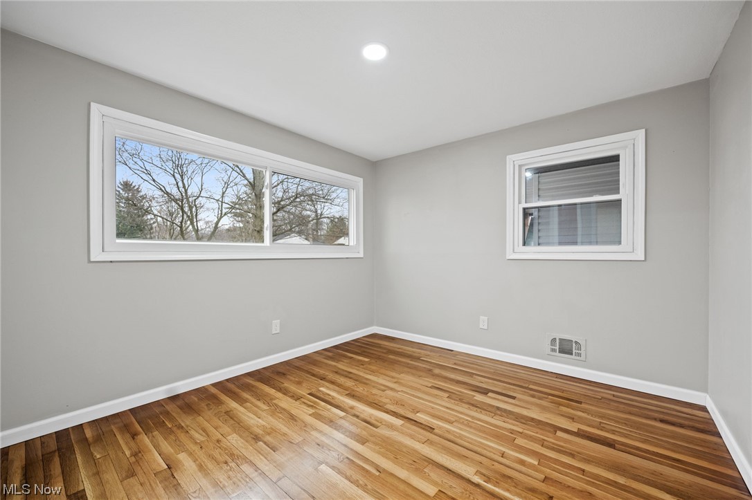 11417 Snow Road Parma Heights, OH 44130 - Photo 17 of 32 bedroom with light hardwood flooring