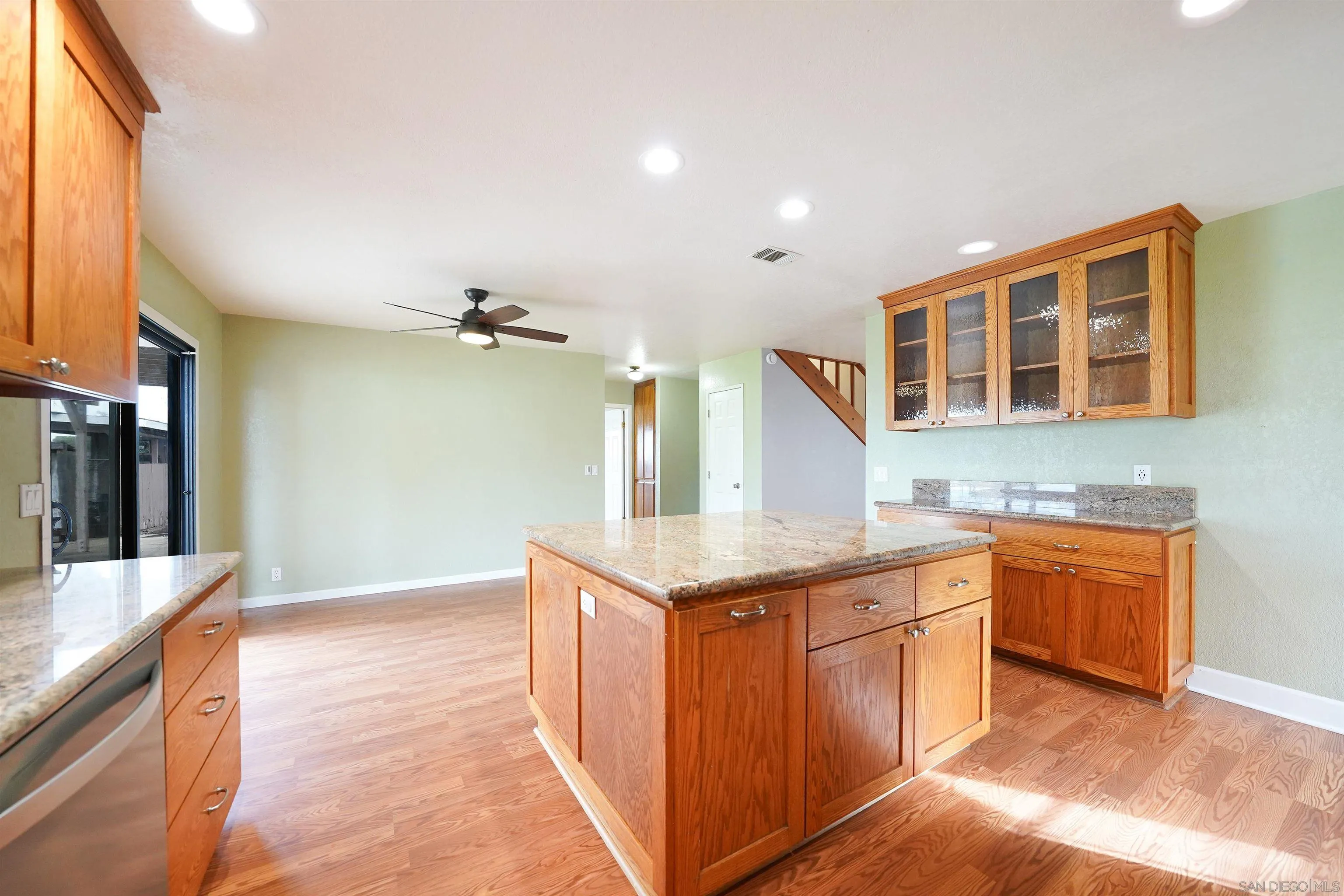 1465 Barnett Road Ramona, CA 92065 - Photo 20 of 43 a kitchen with granite countertop a sink stove and cabinets