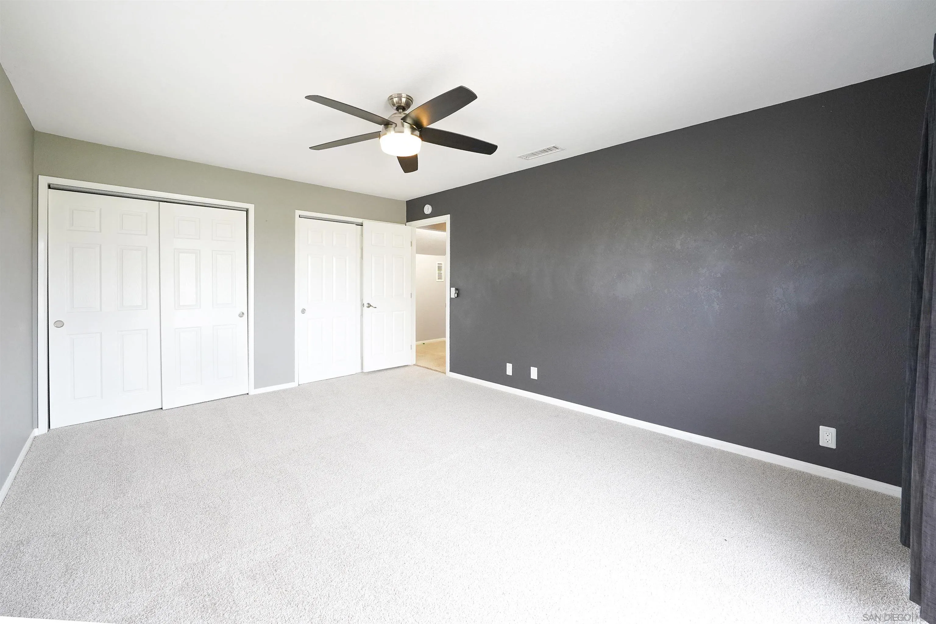 1465 Barnett Road Ramona, CA 92065 - Photo 23 of 43 a view of a big room with a ceiling fan and a window