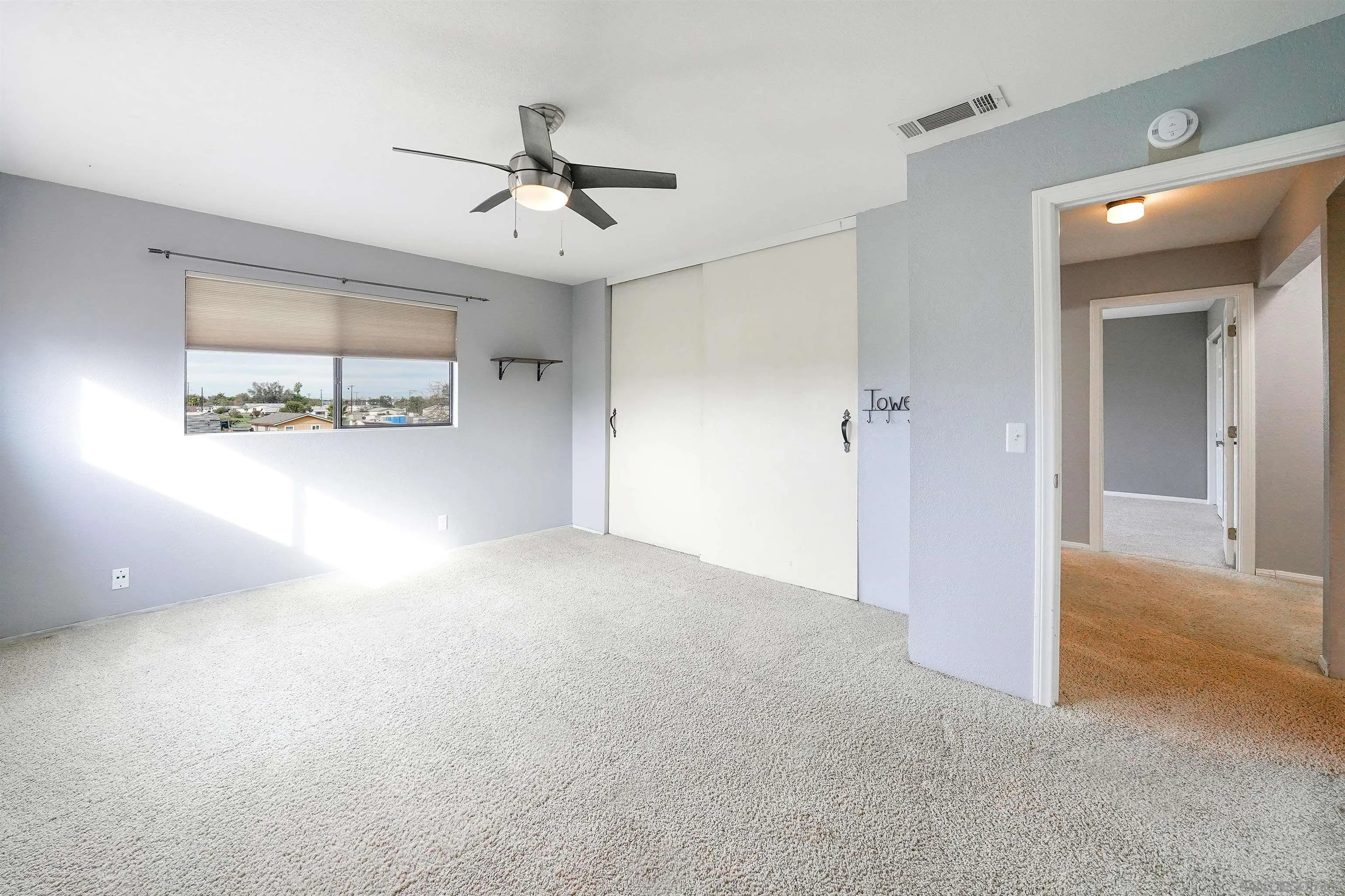 1465 Barnett Road Ramona, CA 92065 - Photo 28 of 43 a view of a room with a ceiling fan and a window