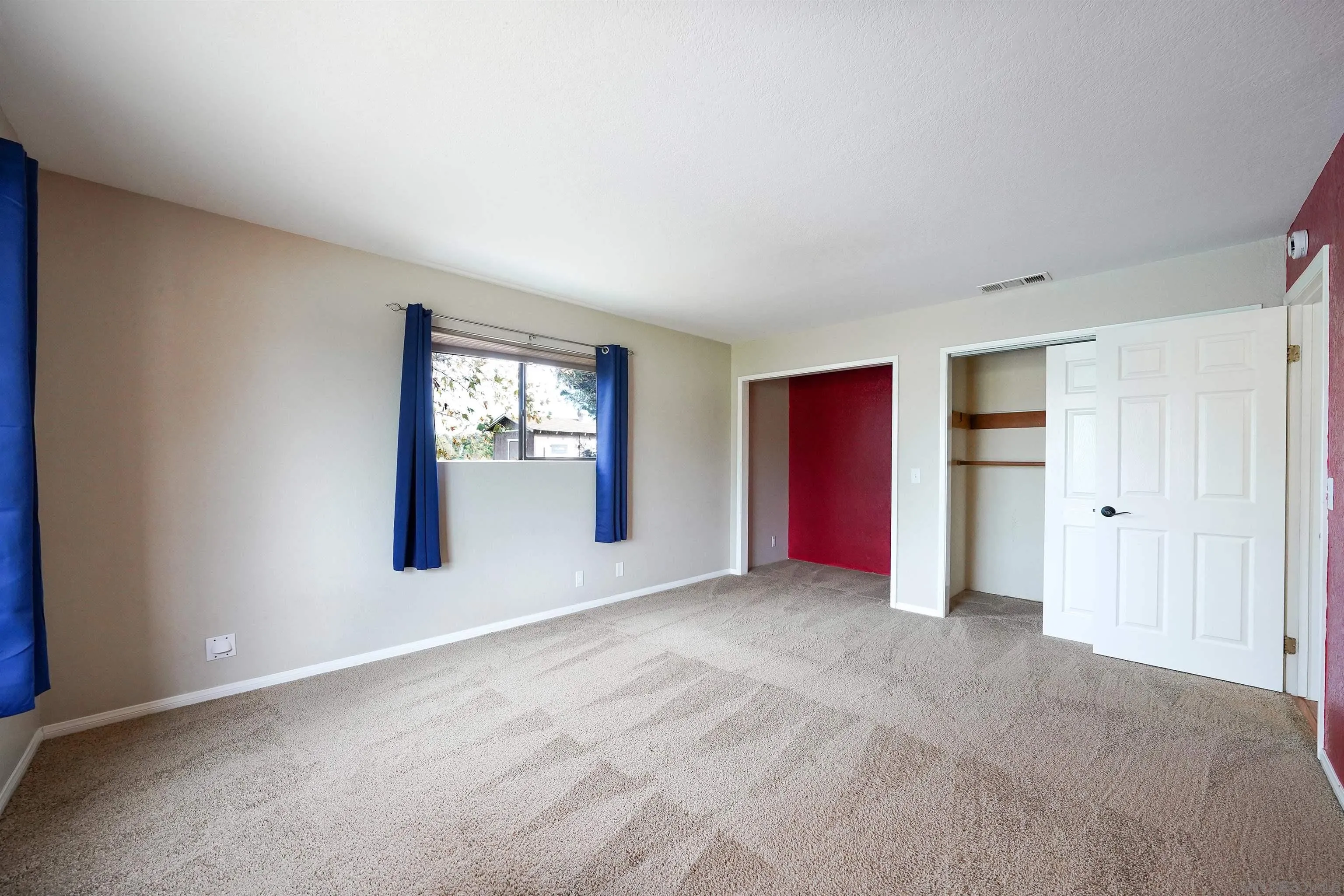 1465 Barnett Road Ramona, CA 92065 - Photo 32 of 43 a view of an empty room with window and closet area