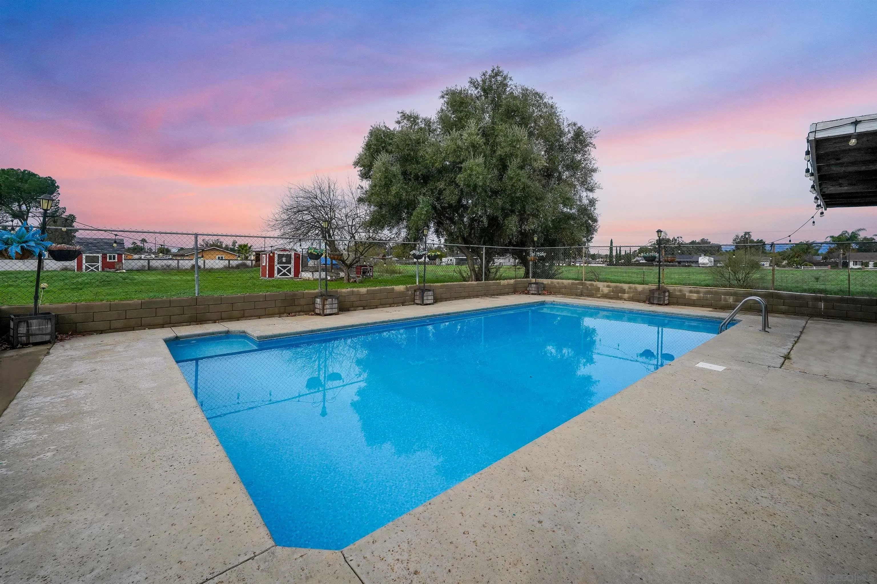 1465 Barnett Road Ramona, CA 92065 - Photo 35 of 43 a view of a swimming pool and trees in the background