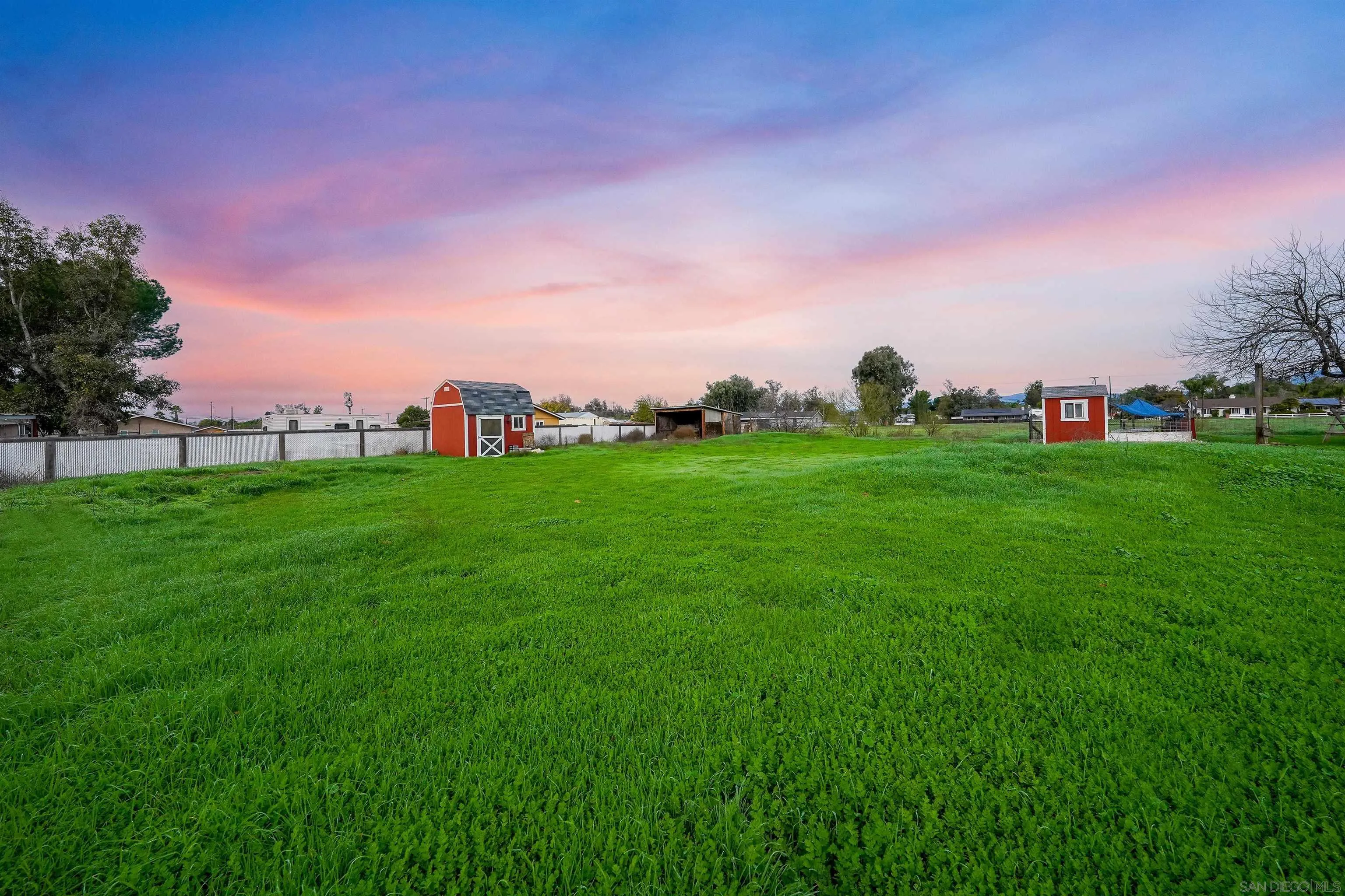 1465 Barnett Road Ramona, CA 92065 - Photo 40 of 43 a backyard of a house with lots of green space and mountain view in back