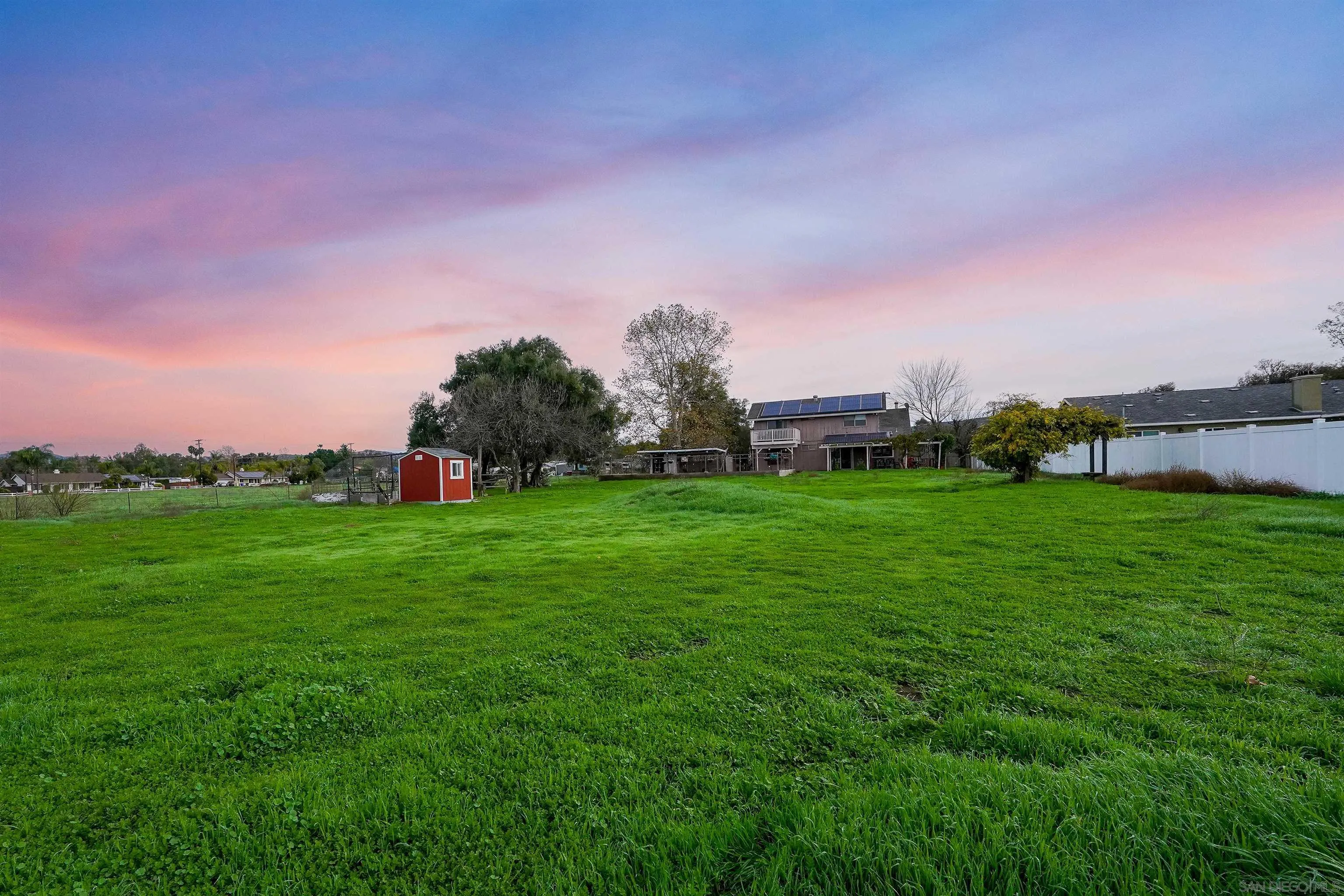 1465 Barnett Road Ramona, CA 92065 - Photo 41 of 43 a view of a green field with house in the background