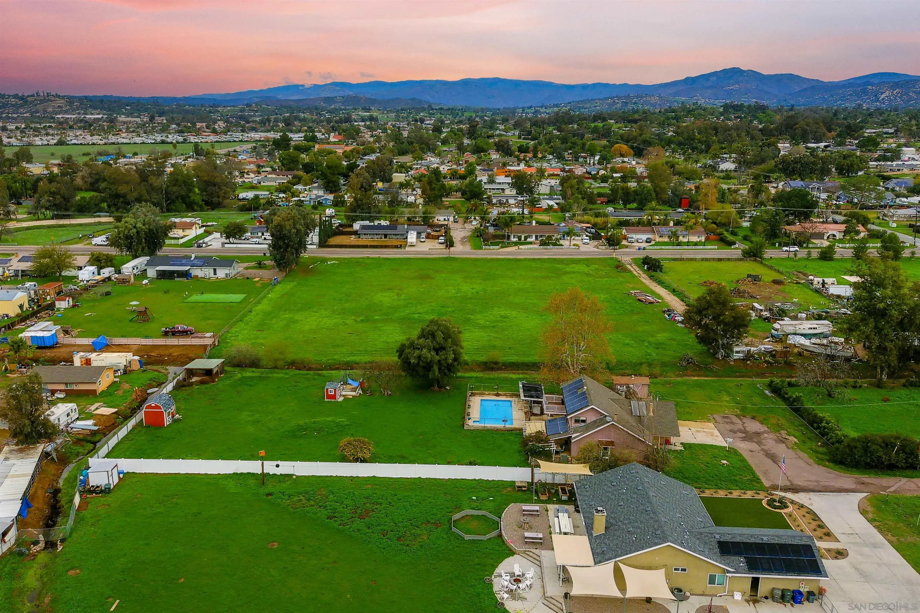 1465 Barnett Road Ramona, CA 92065 - Photo 8 of 43 an aerial view of a houses with a garden and lake view