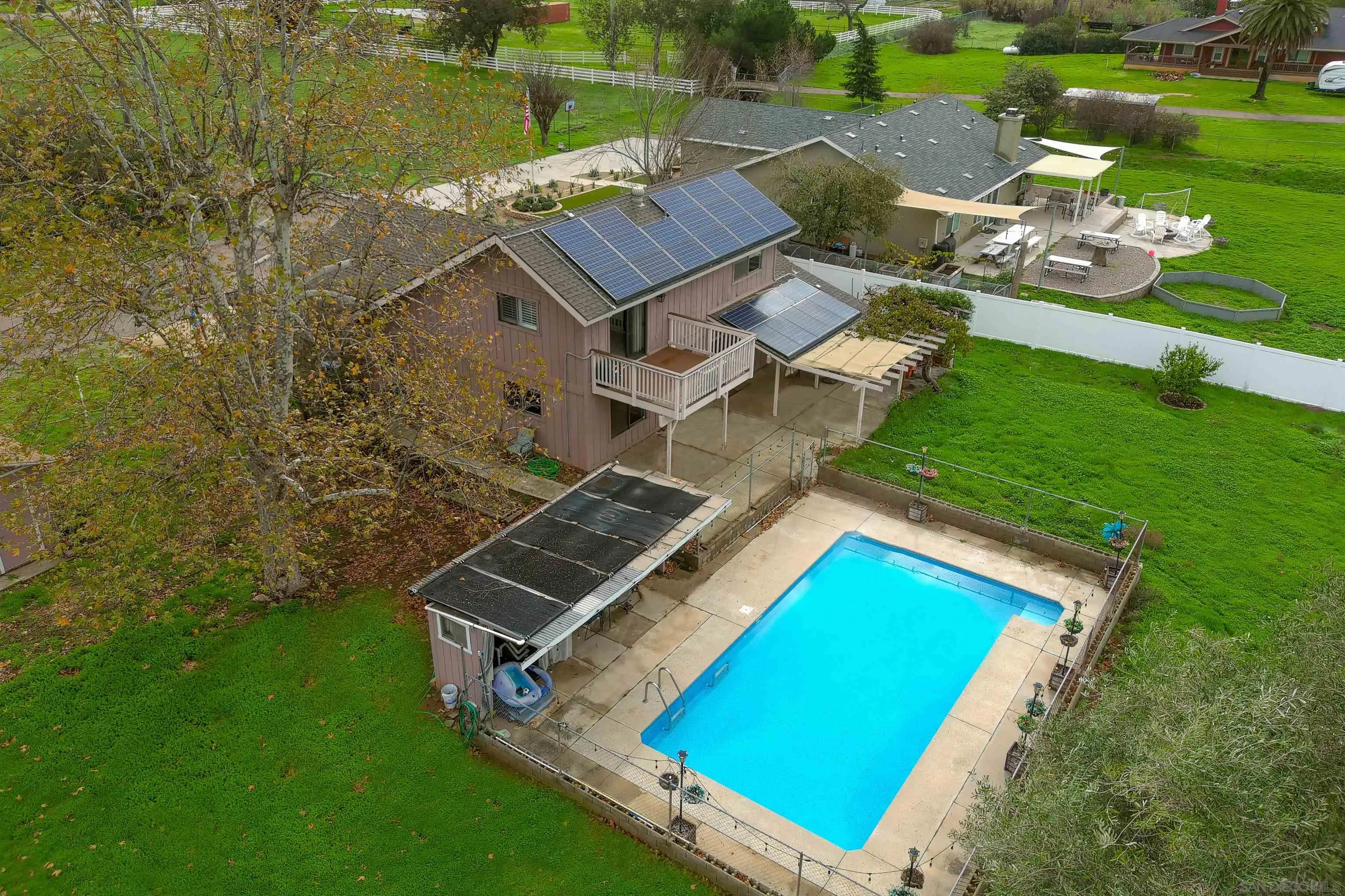 1465 Barnett Road Ramona, CA 92065 - Photo 9 of 43 an aerial view of a house with a garden and lake view