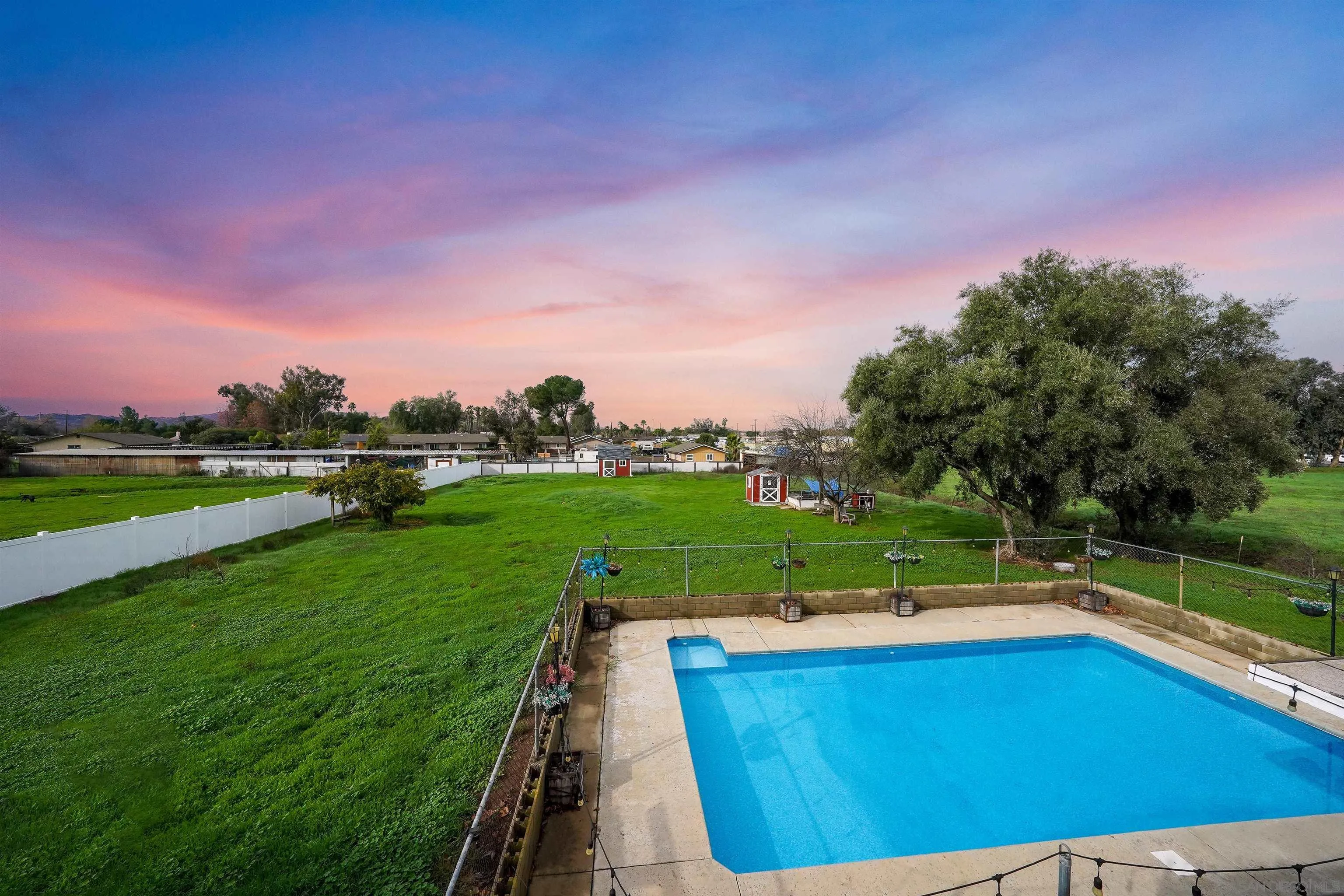 1465 Barnett Road Ramona, CA 92065 - Photo 10 of 43 a view of a swimming pool with a yard