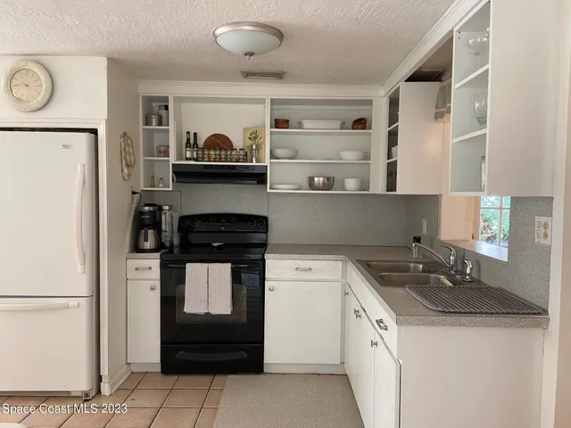 a kitchen with stainless steel appliances a stove and a refrigerator