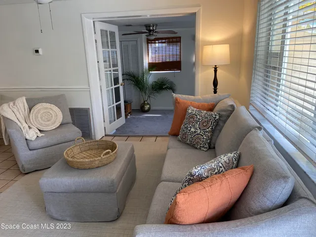 a living room with furniture and a window