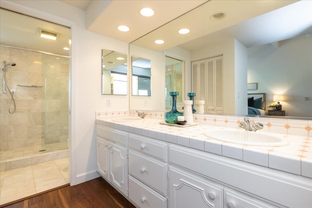 797 St George Road Danville, CA 94526 - Photo 18 of 52 a bathroom with a granite countertop sink mirror and bathtub