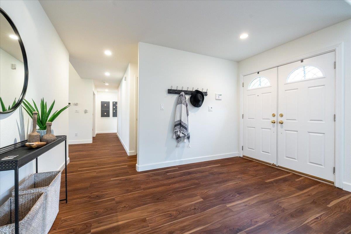 797 St George Road Danville, CA 94526 - Photo 4 of 52 a view of a hallway with wooden floor and a potted plant