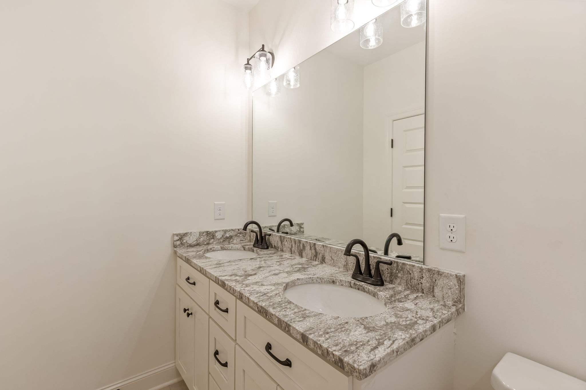 410 Hatcher Lane Columbia, TN 38401 - Photo 8 of 10 a bathroom with a granite countertop sink and a mirror