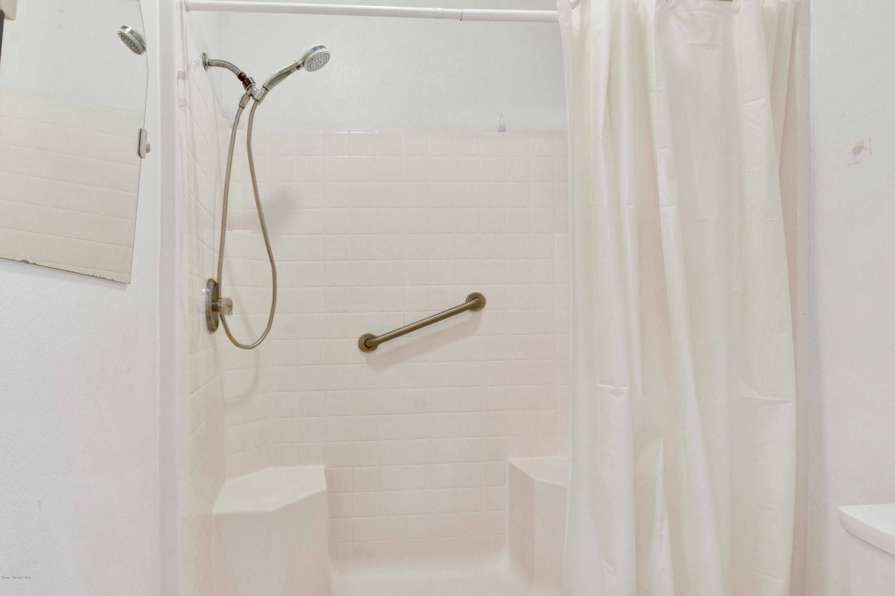 1030 Meadowbrook Road Northeast Palm Bay, FL 32905 - Photo 12 of 24 a bathroom with a shower