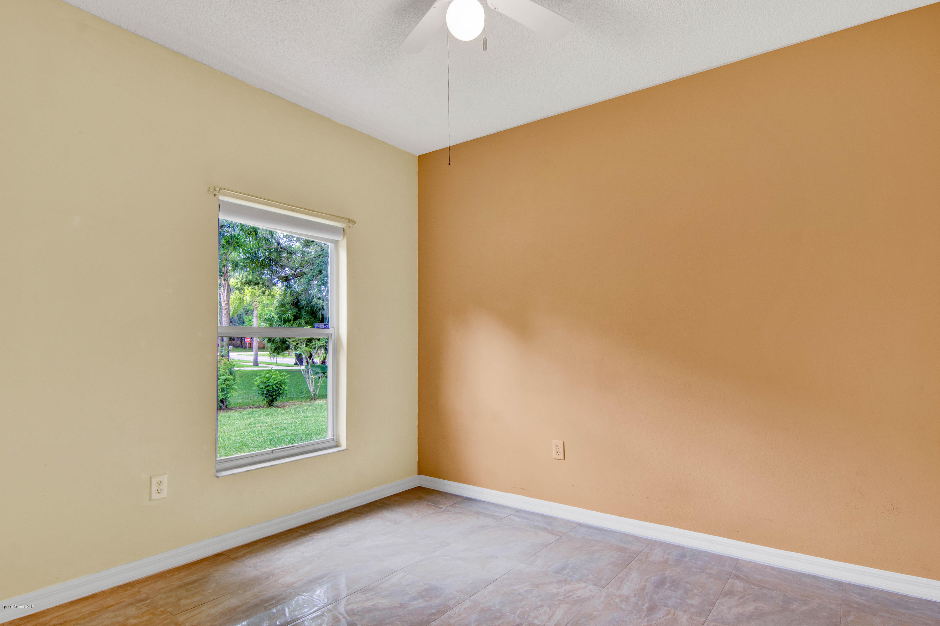 1030 Meadowbrook Road Northeast Palm Bay, FL 32905 - Photo 14 of 24 an empty room with a window