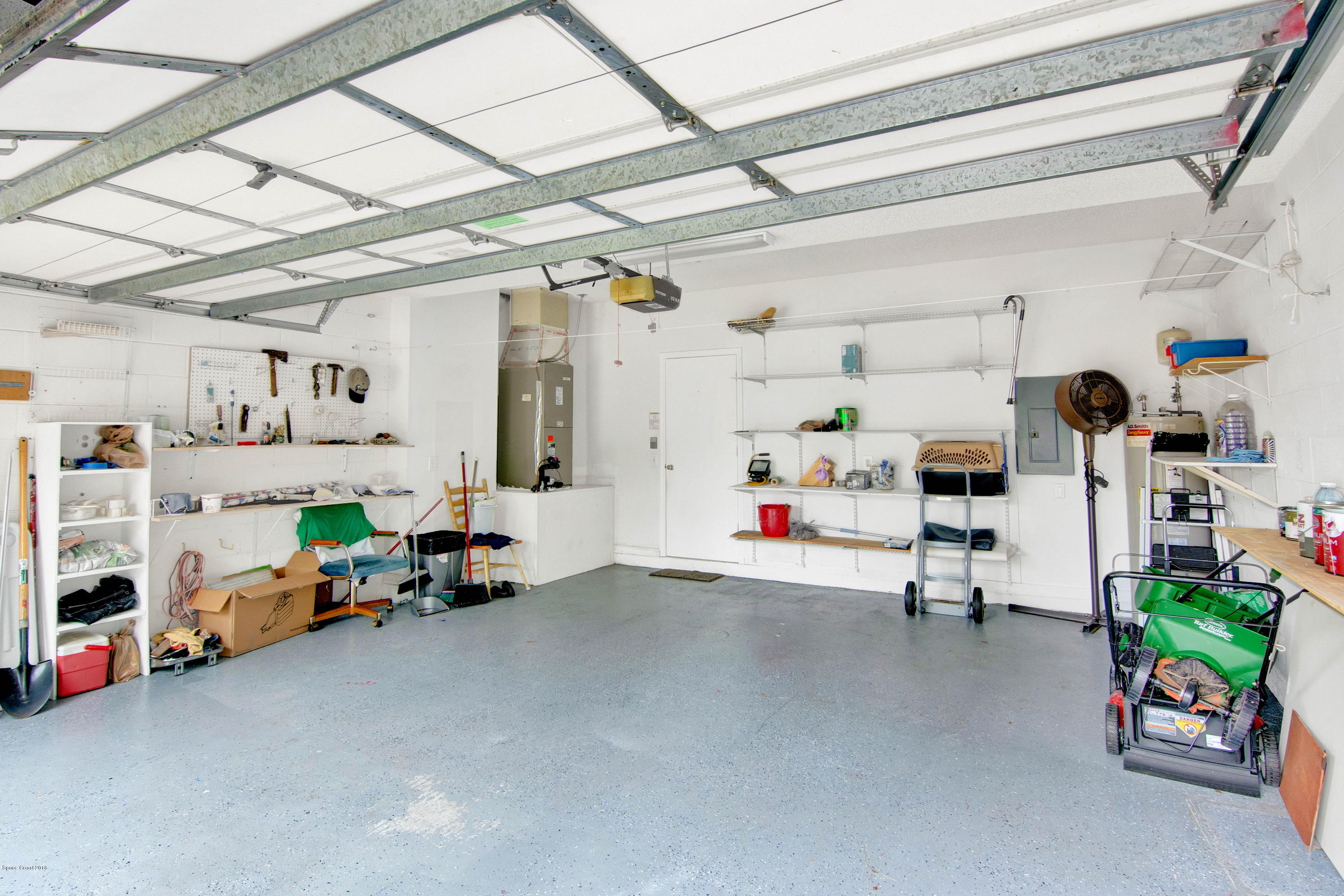 1030 Meadowbrook Road Northeast Palm Bay, FL 32905 - Photo 18 of 24 a view of storage and utility room with toys